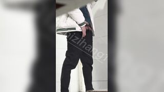 Male students are pissing in the toilet.