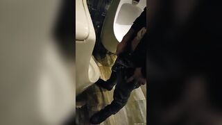 Males are pissing in the toilet 2