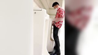 A male is pissing in the toilet4