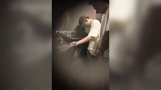 Males are pissing in the toilet.3