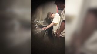 Males are pissing in the toilet.3