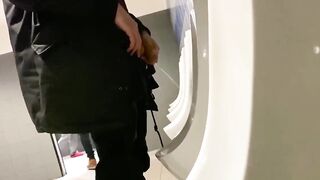 A male is pissing in the toilet 6