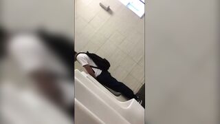 Males are pissing in the toilet.