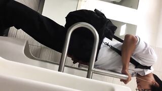 Males are pissing in the toilet.