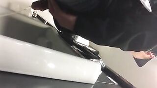 Males are pissing in the toilet.