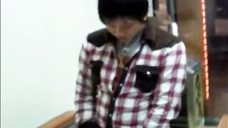 Males are pissing in the toilet.