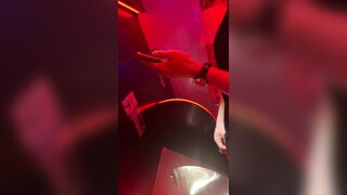 A male is pissing in the toilet.