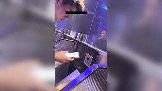 A male is pissing in the toilet.