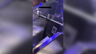 A male is pissing in the toilet.