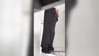 Male students are pissing in the toilet.