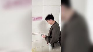 Male students are pissing in the toilet.