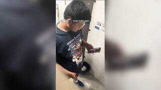 Male students are pissing in the toilet.