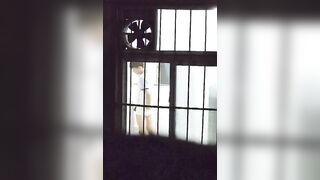 A male student is pissing in the toilet.