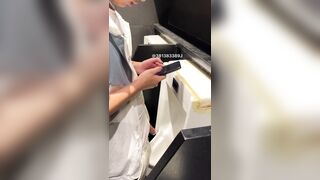 A male student is pissing in the toilet.