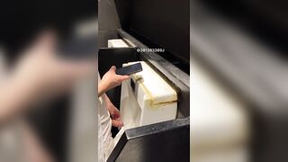 A male student is pissing in the toilet.