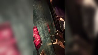 A male is pissing in the toilet.