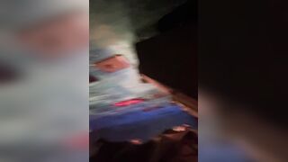 A male is pissing in the toilet.