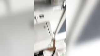 A male is pissing in the toilet.