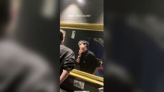A male is pissing in the toilet.