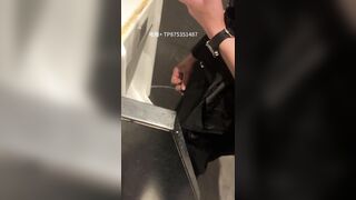 A male is pissing in the toilet.